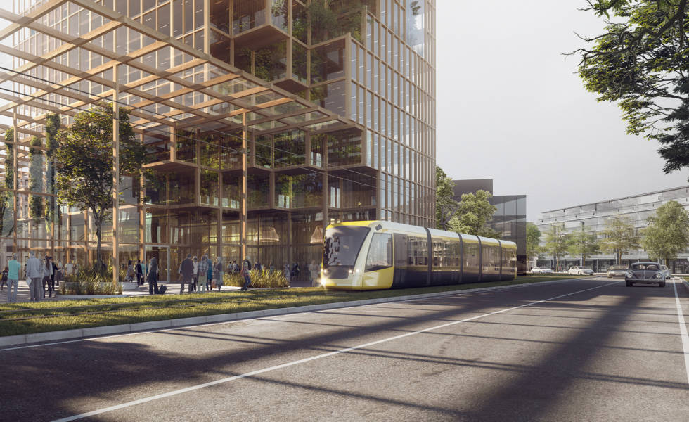 Raitiovaunu kulkee modernin kerrostalon edustalla tulevaisuuden Raision keskustassa.